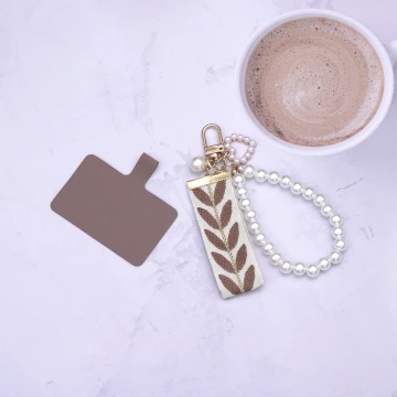 豹紋垂墜珍珠×吊墜耳環.avif